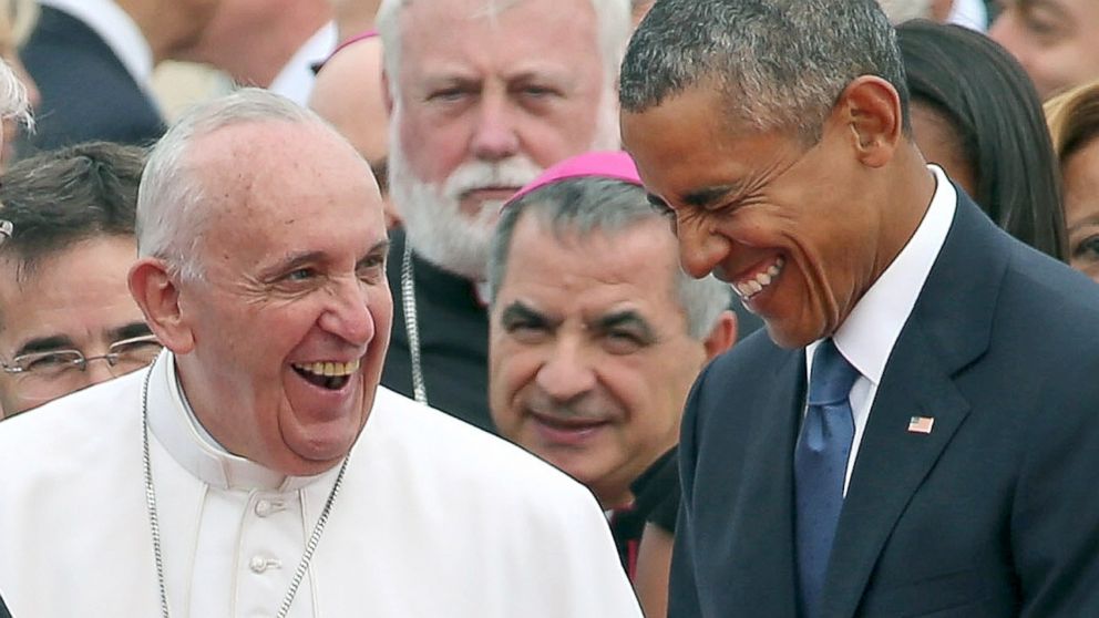 Pope Francis is escorted by President Barack Obama as he greets and other political and Catholic church leaders after arriving from Cuba, Sept. 22, 2015 at Joint Base Andrews, Md.