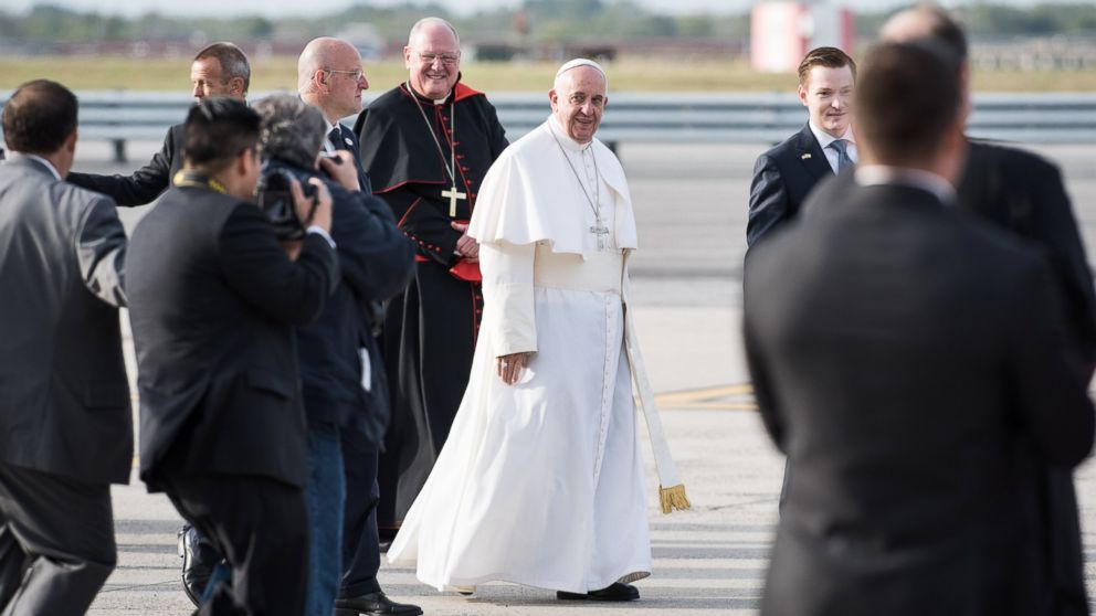 Pope Francis walks the tarmac before boarding his flight from New York en route to Philadelphia from John F. Kennedy International Airport on Sept. 26, 2015 in New York.