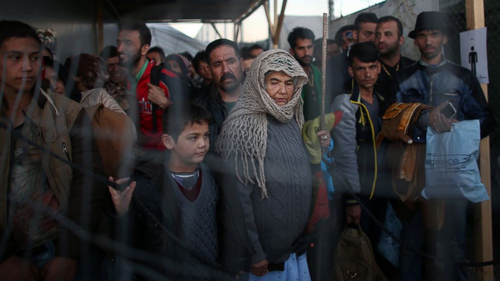 Migrants and refugees wait in a queue after making the crossing from Turkey to the Greek island of Lesbos on Nov. 14, 2015 in Sikaminias, Greece.