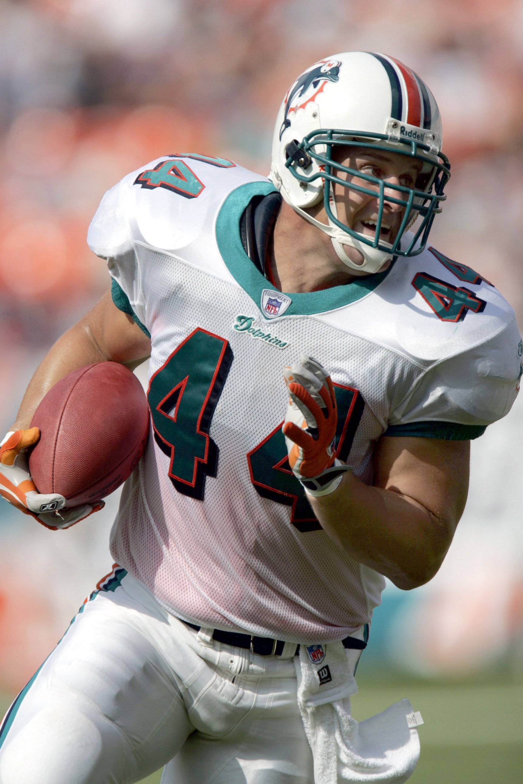 PHOTO: Fullback Rob Konrad #44 of the Miami Dolphins heads into the end zone for a touchdown against the Arizona Cardinals in Miami, Fla., in this Nov. 7, 2004, file photo.