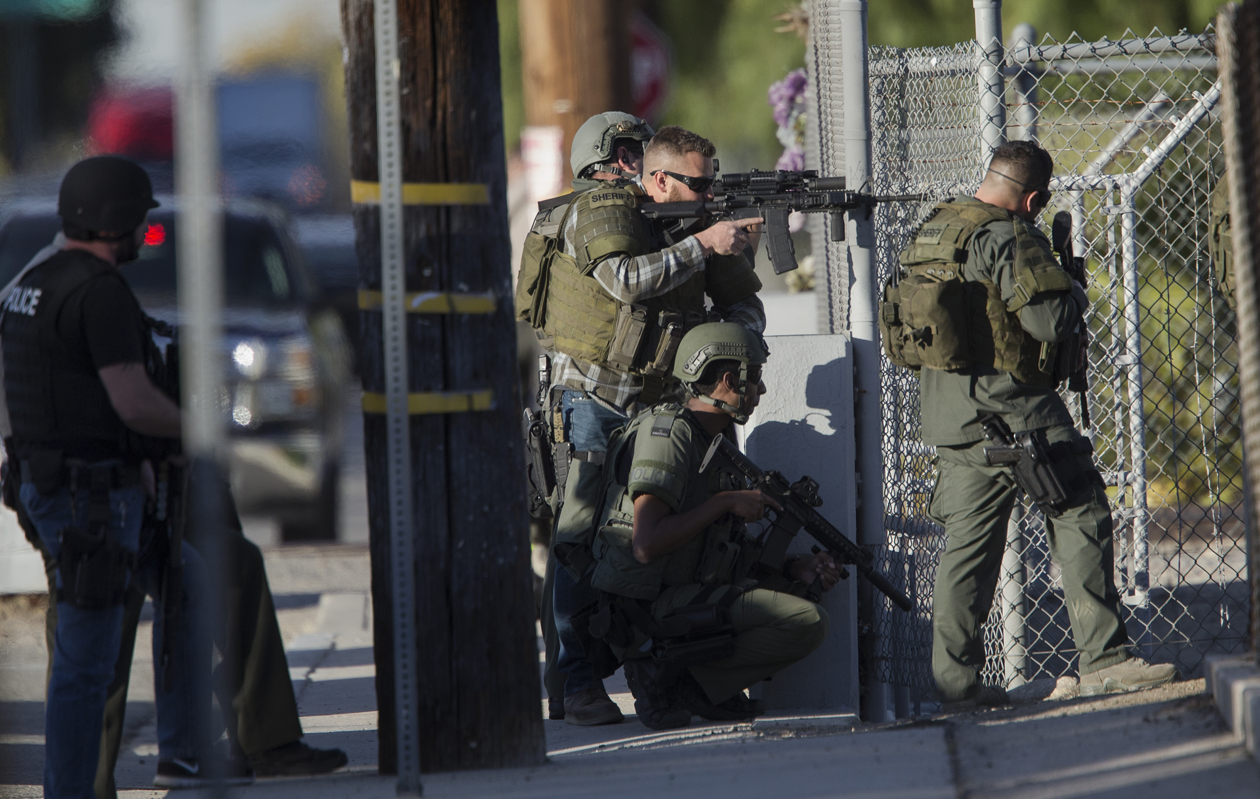 PHOTO: SWAT officers search near Victoria Elementary School on Richardson Street for the suspects involved in the mass shooting of 14 people at the Inland Regional Center on Dec. 2, 2015 in San Bernardino, Calif.
