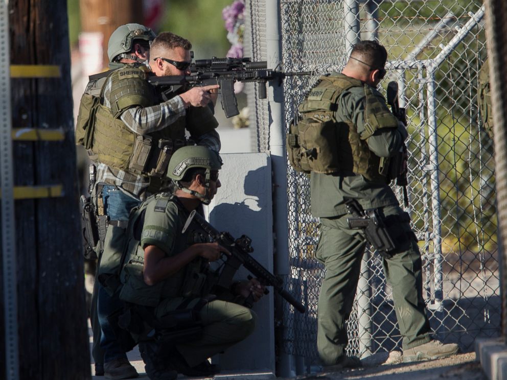 PHOTO: SWAT officers search near Victoria Elementary School on Richardson Street for the suspects involved in the mass shooting of 14 people at the Inland Regional Center on Dec. 2, 2015 in San Bernardino, Calif.