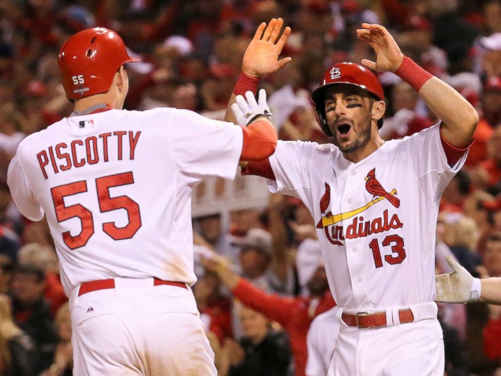 PHOTO: The St. Louis Cardinals' Stephen Piscotty is greeted at home plate by Matt Carpenter after hitting a two-run home run against the Chicago Cubs, Oct. 9, 2015, at Busch Stadium in St. Louis.