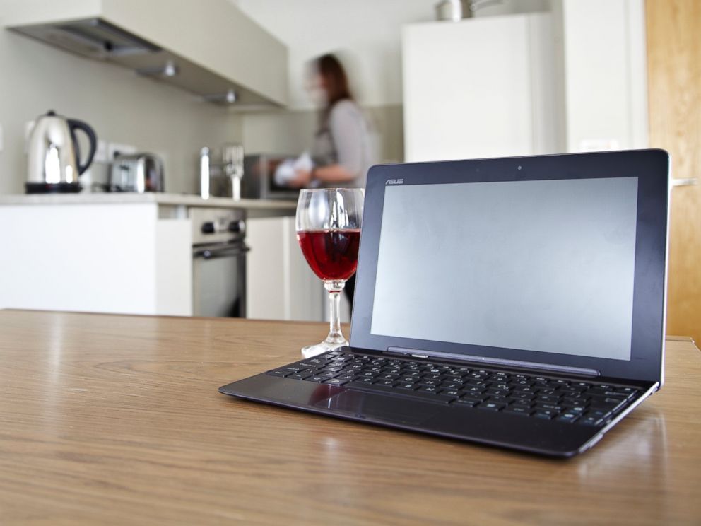 PHOTO: A laptop on a kitchen table with a glass of red wine, in this stock photo taken on July 23, 2012.