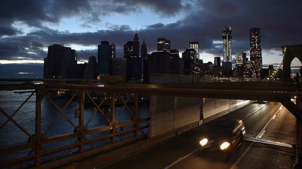 The partially lit skyline of lower Manhattan is seen from the Brooklyn Bridge, Nov. 3, 2012, in New York.