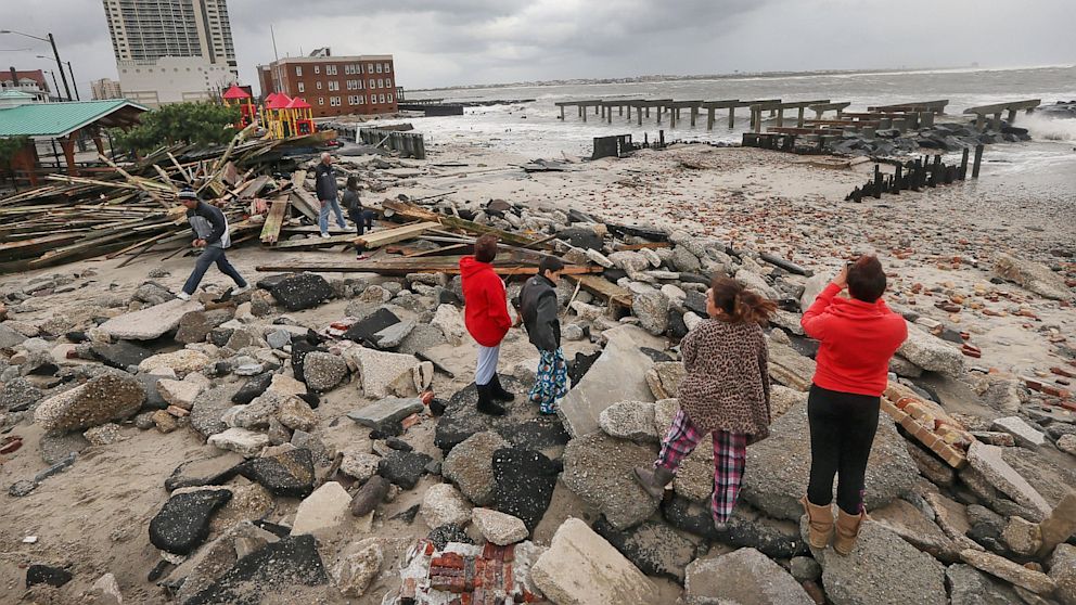 People view the area where a 2000-foot section of the "uptown" boardwalk was destroyed by flooding from Hurricane Sandy, Oct. 30, 2012 in Atlantic City, 