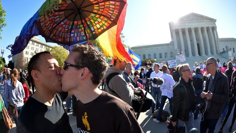 PHOTO: A gay couple kisses outside the US Supreme Court on April 28, 2015 as the court hears arguments on whether gay couples have a constitutional right to wed - a potentially historic decision that could see same-sex marriage recognized nationwide.