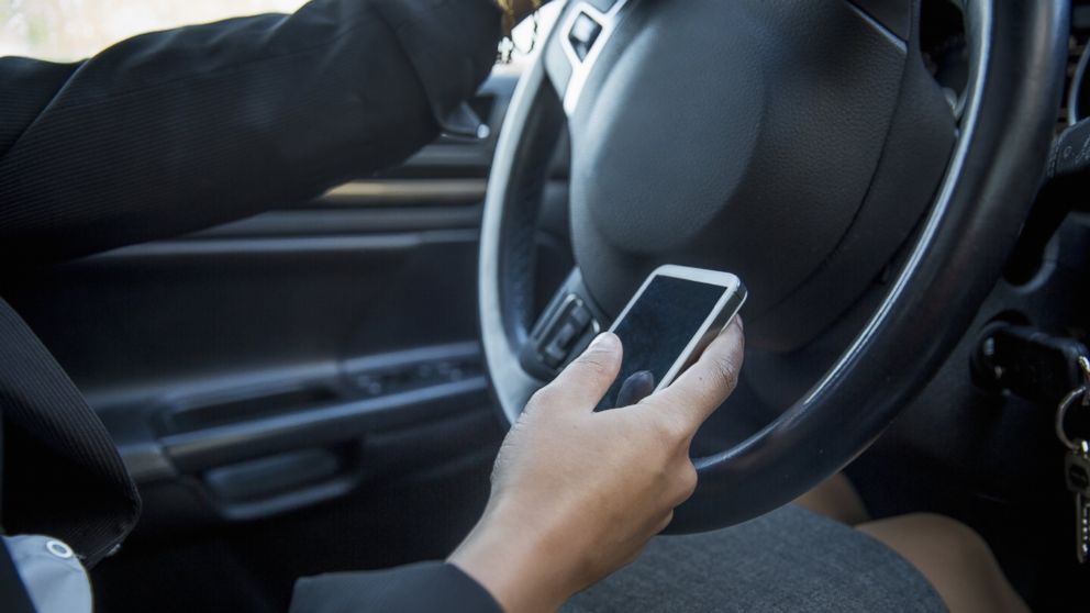 A women appears to text while driving in this undated file photo. 