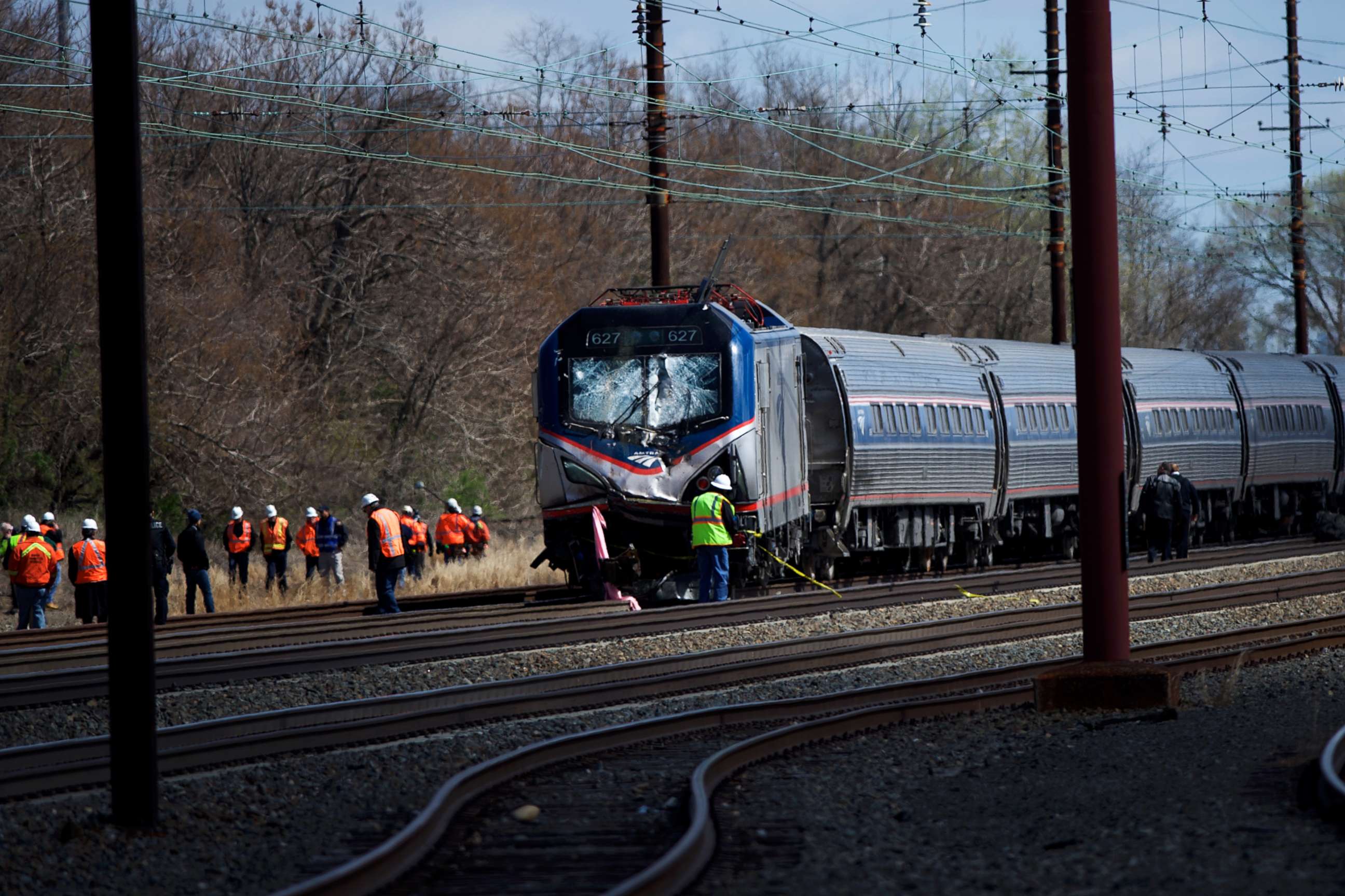 PHOTO: Emergency personnel investigate the crash site of Amtrak Palmetto train 89  in this April 3, 2016 file photo in Chester, Pa.
