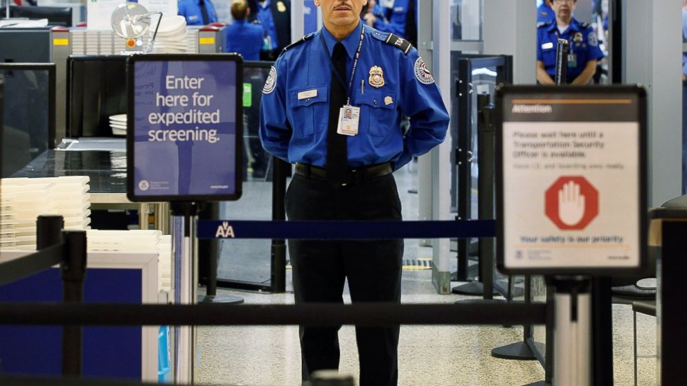 A TSA agent waits for passengers at Miami International Airport on Oct. 4, 2011, in Miami, Florida.