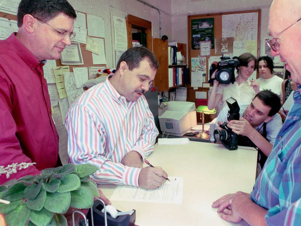 PHOTO: Joe Skirchak and Pat Cerra of Plainfield, N.H., fill out civil union paperwork with Hartland, Vt., town clerk Clyde Jenne on July 1, 2000.