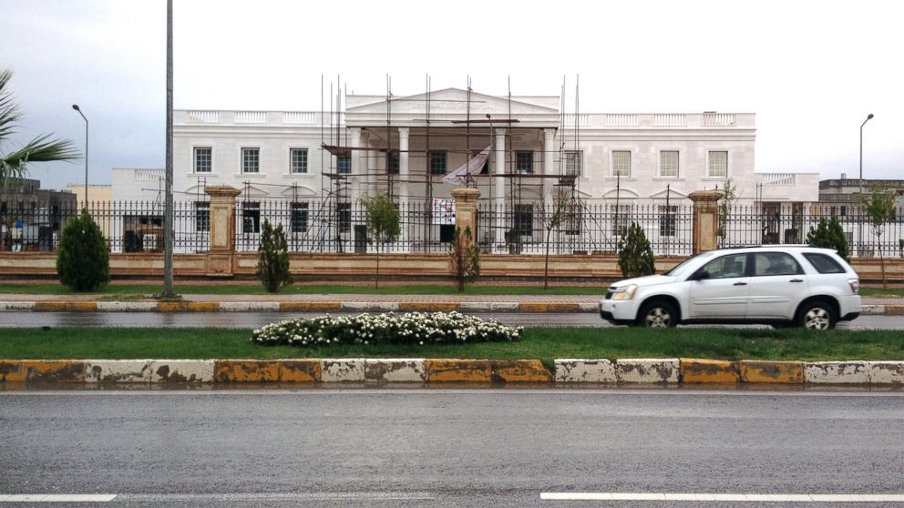 PHOTO: A car drives past a building known as Erbil's White House during construction in the Iraqi Kurdish city of Erbil, Iraq, Oct. 16, 2014. 
