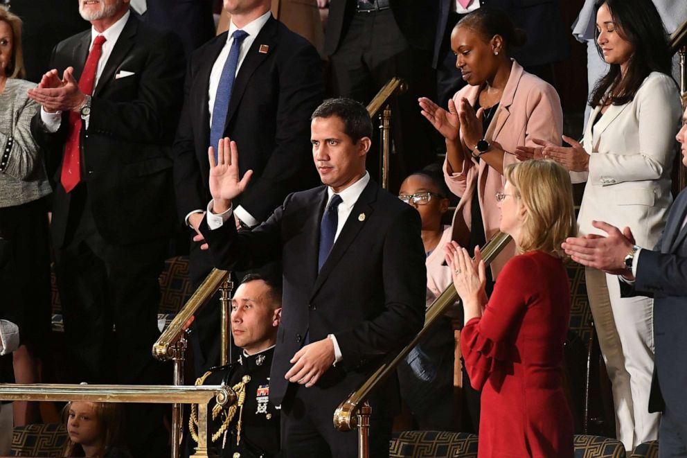 PHOTO: Venezuelan opposition leader Juan Guaido (C) waves as he is acknowledged by US President Donald Trump during his the State of the Union address at the US Capitol in Washington, DC, on February 4, 2020.