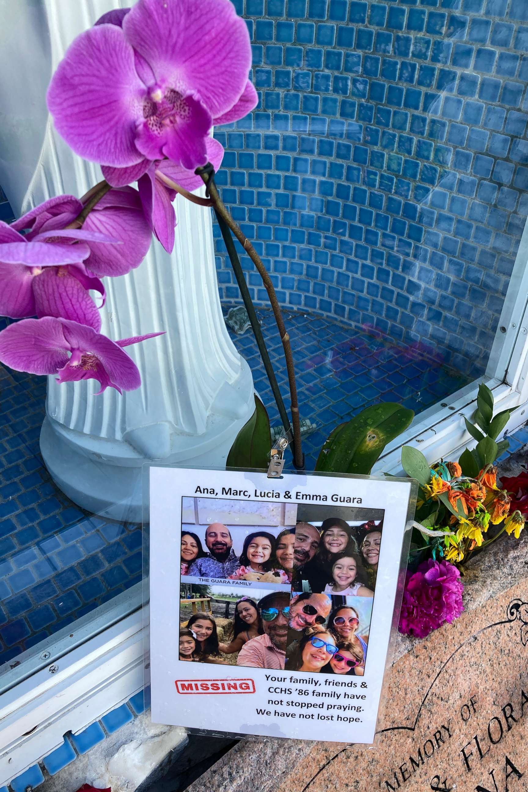 PHOTO: A shrine for the Guara family has been setup outside St. Joseph Catholic Church, in Surfside, Fla., June 28, 2021, near the collapsed building.