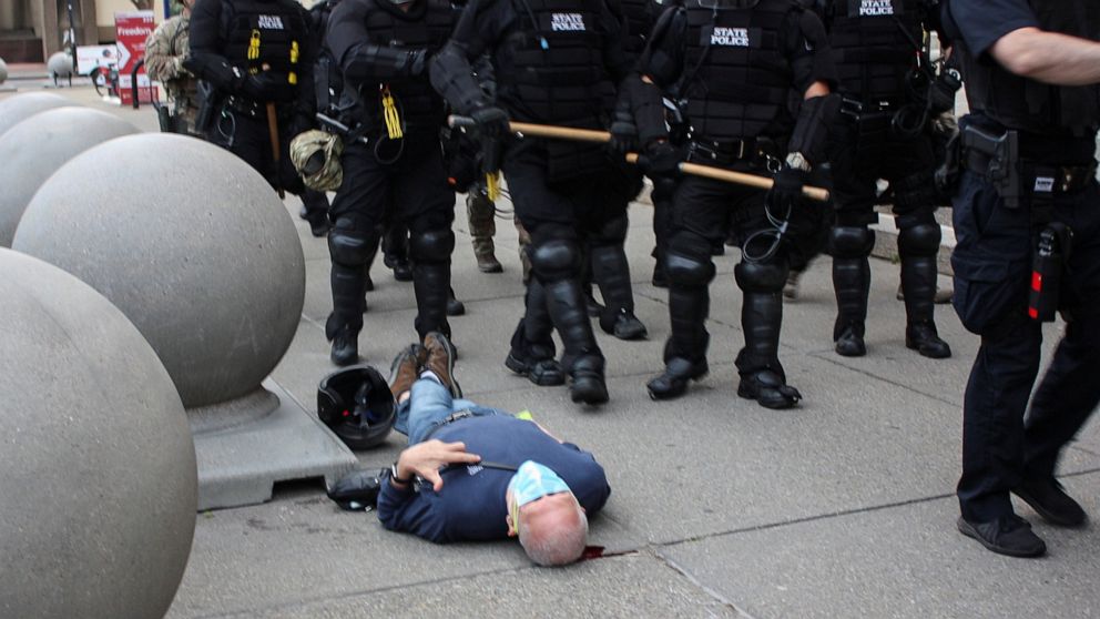 PHOTO: Martin Gugino, a 75-year-old protester, lays on the ground after he was shoved by two police officers, during a protest against the death in Minneapolis police custody of George Floyd, in Buffalo, New York's Niagara Square on June 4, 2020.