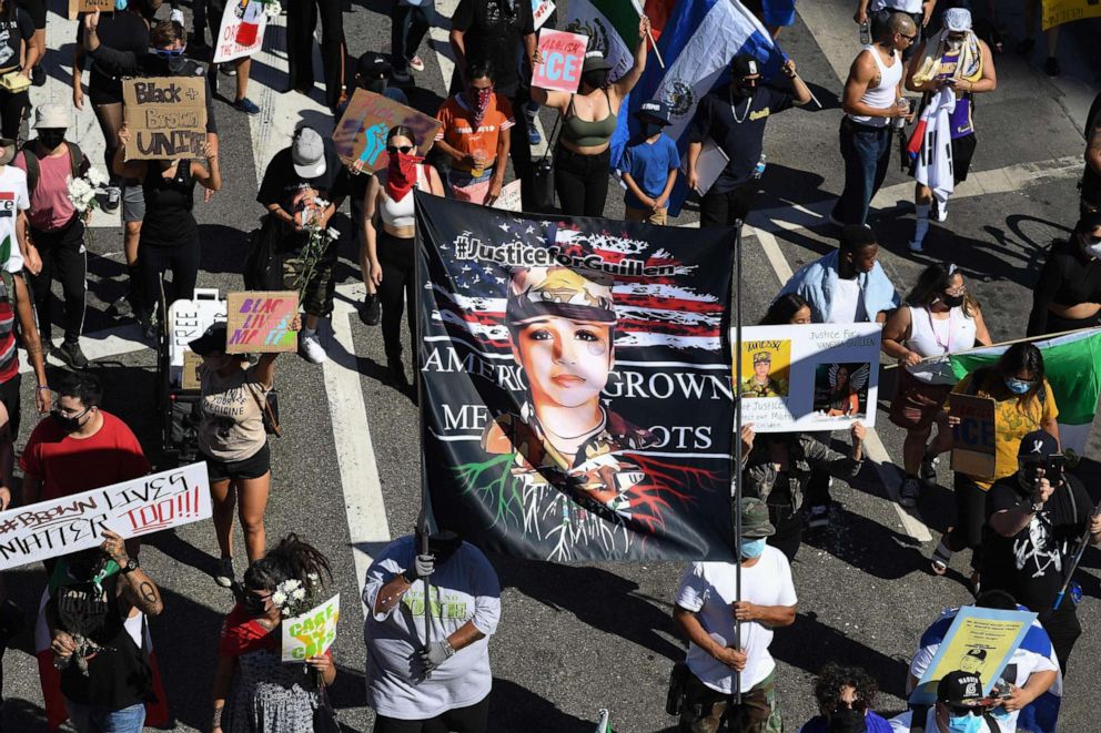 PHOTO: Demonstrators hold a banner demanding justice for slain Army solder Vanessa Guillen as protesters of the Latino and indigenous community take part in the Black and Brown Unity March in Los Angeles, July 12, 2020.