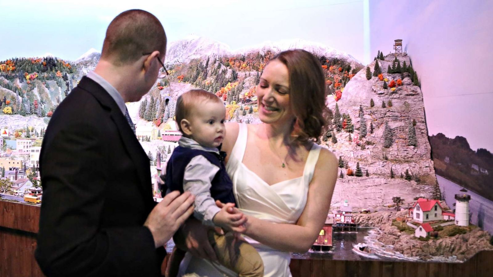 PHOTO: Micah and Jenna Tucker renew their vows at Gulliver's Gate by the miniature version of the city where they met - Boston.