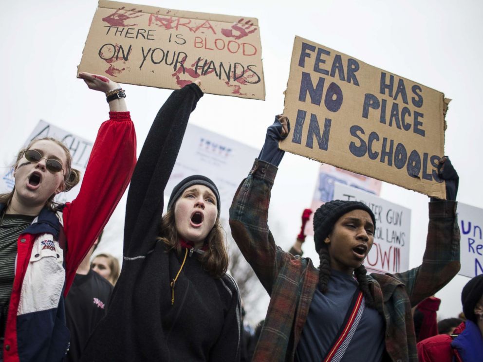 PHOTO: Demonstrators hold signs during a lie-in demonstration supporting gun control reform near the White House, Feb. 19, 2018, in Washington, D.C.