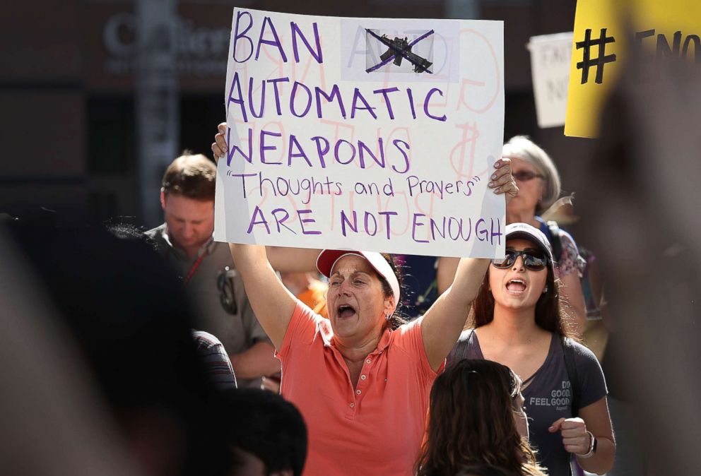 PHOTO: People join together after a school shooting that killed 17 to protest against guns on the steps of the Broward County Federal courthouse, Feb. 17, 2018 in Fort Lauderdale, Fla.