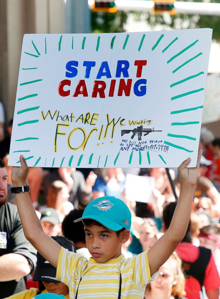 PHOTO: Protesters hold signs at a rally for gun control at the Broward County Federal Courthouse in Fort Lauderdale, Fla., Feb. 17, 2018.