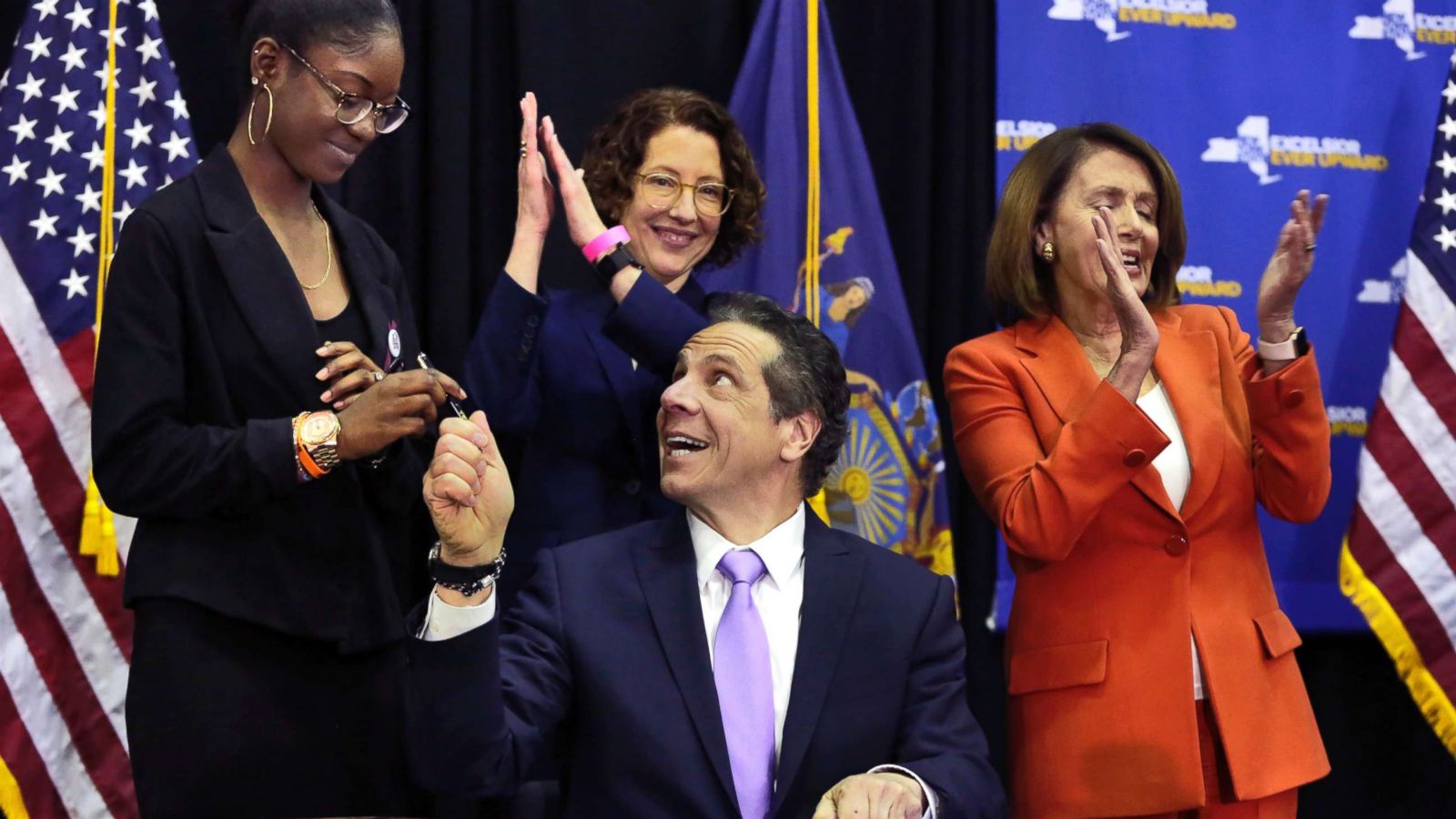 PHOTO: New York Gov. Andrew Cuomo hands a pen to Marjory Stoneman Douglas High School student Aalayah Eastmond, left, as he signs a bill at John Jay College of Criminal Justice, that removes guns from domestic abusers, May 1, 2018, in New York.