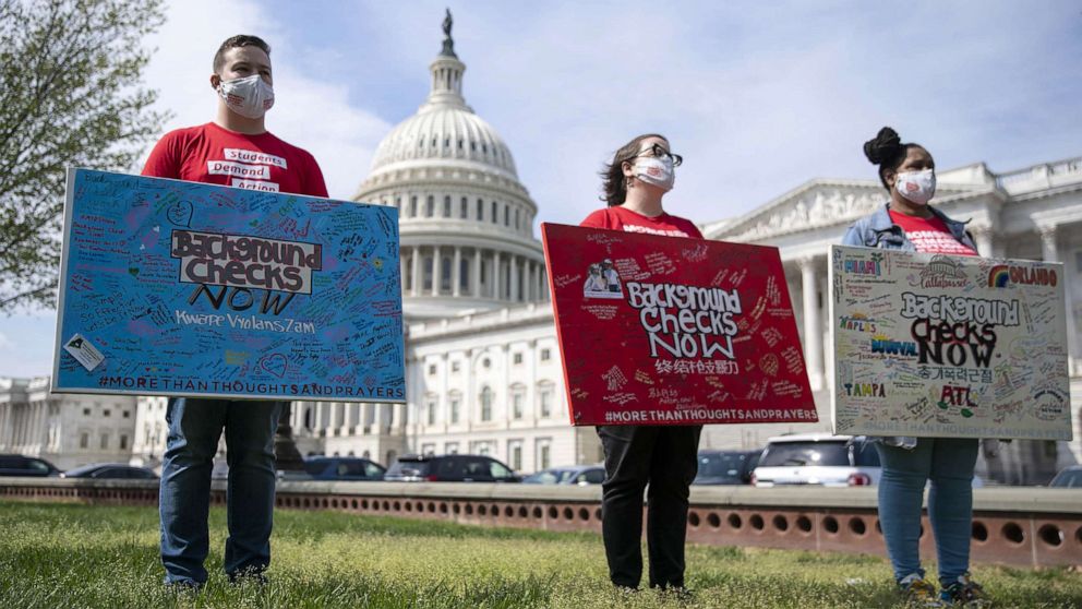 PHOTO: In this April 15, 2021, file photo, advocates hold signs demanding background checks on gun sales during a news conference hosted by Everytown for Gun Safety and Moms Demand Action outside the U.S. Capitol in Washington, D.C.