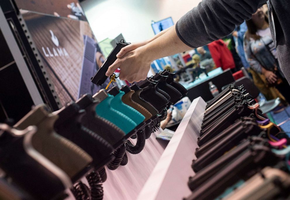 PHOTO: NRA members are seen checking out weapons and accessories during an exhibition in Indianapolis, Ind. on March 27, 2019.