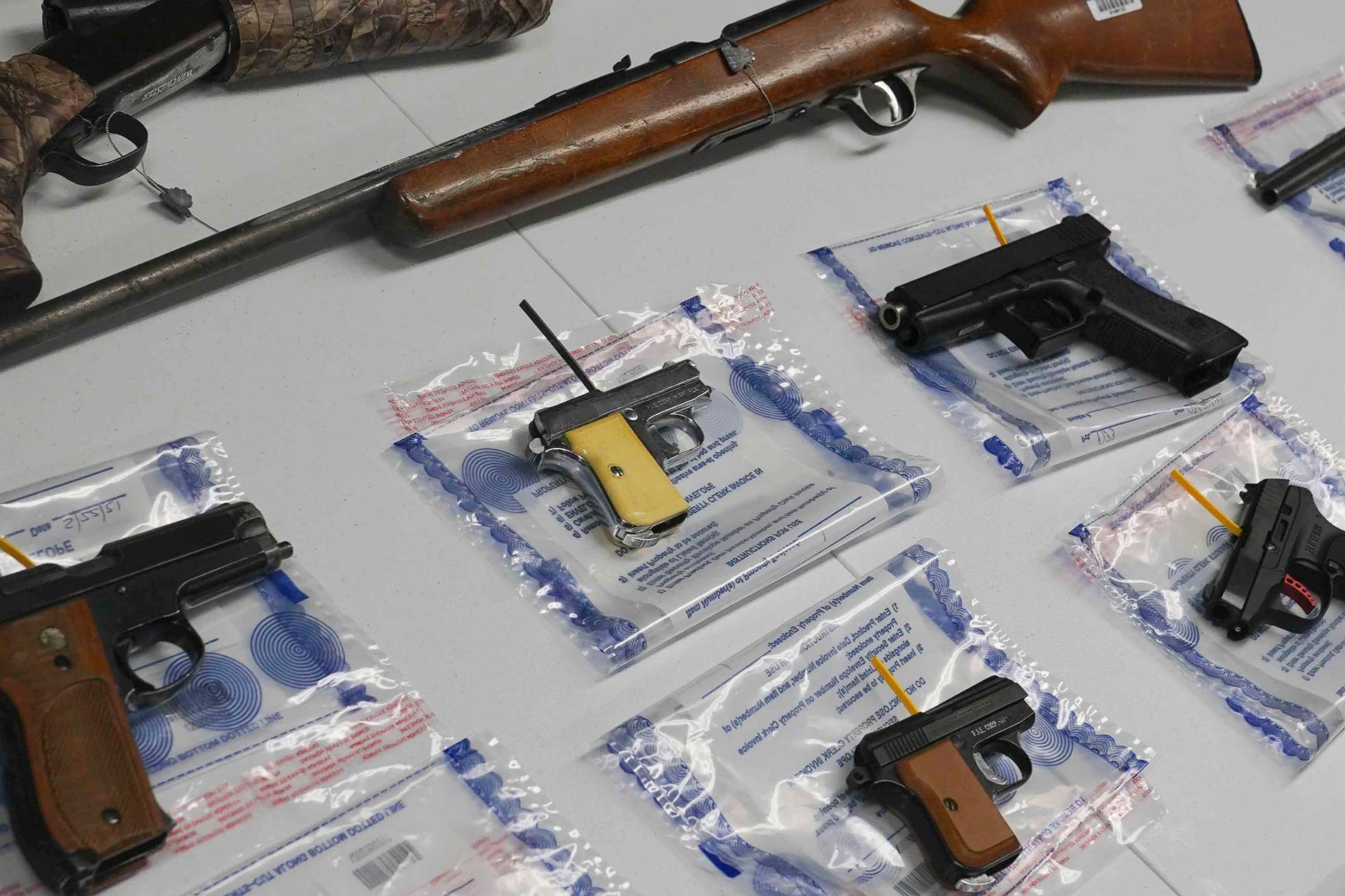 PHOTO: FILE - A collection of illegal guns is displayed during a gun buyback event, May 22, 2021 in the Brooklyn borough of New York.