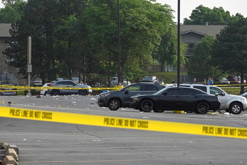 PHOTO: Investigators look over the scene of an overnight mass shooting at a strip mall in Willowbrook, Ill., June 18, 2023.