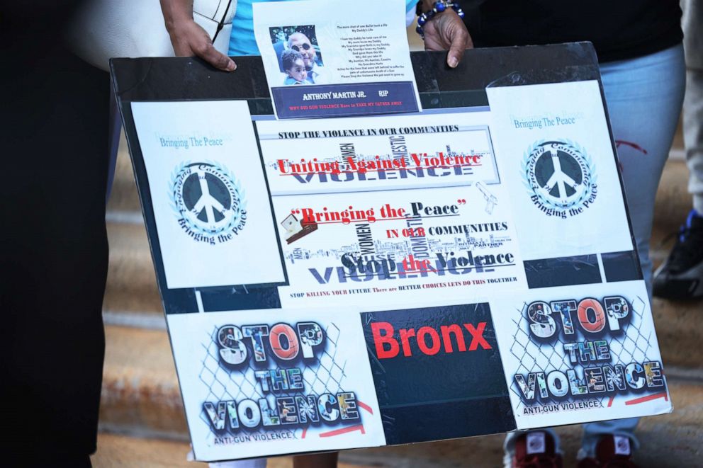 PHOTO: NEW YORK, NEW YORK - JULY 19: A person holds a "Stop the Violence" sign during the "Stand Up Against Gun Violence" press conference and rally at Bronx Borough Hall on July 19, 2021 in South Bronx in New York City. 