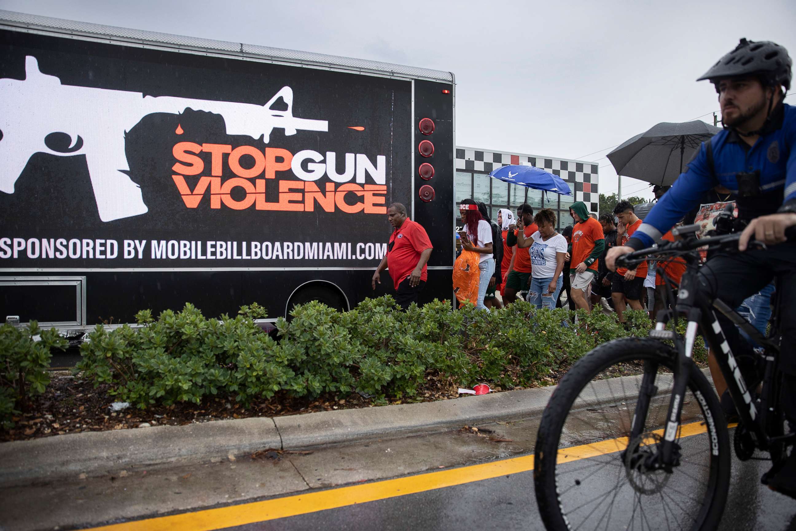 PHOTO: People walk together during a Gun Violence Peace March, June 16, 2021, in Miami.