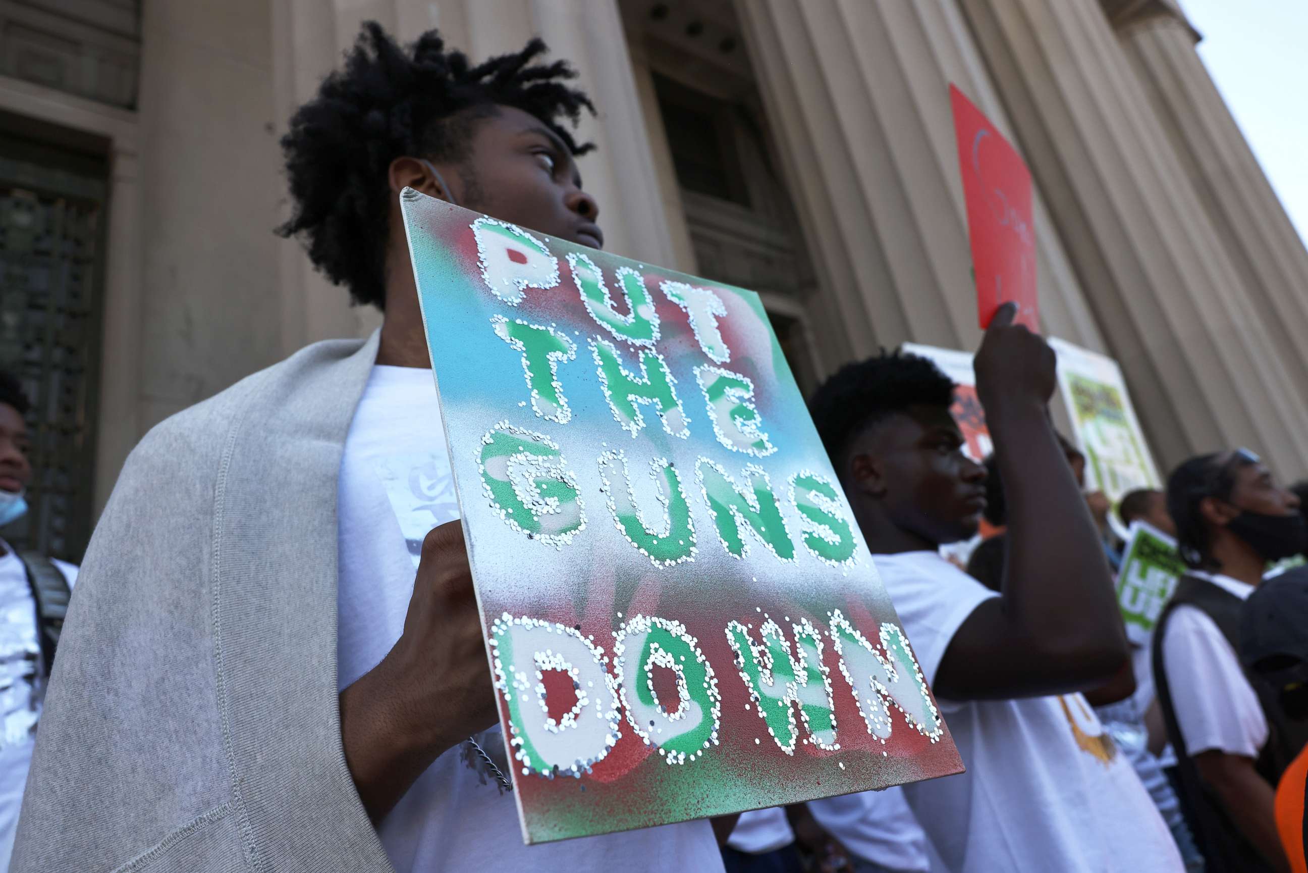 PHOTO: NEW YORK, NEW YORK - JULY 19: People gather at the "Stand Up Against Gun Violence" rally at Bronx Borough Hall on July 19, 2021 in South Bronx in New York City. 