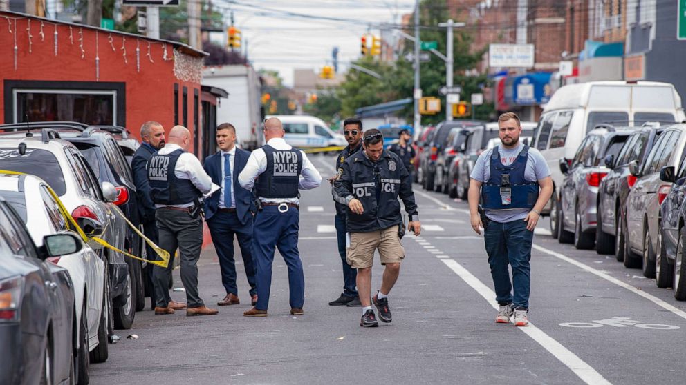 PHOTO:New York Police Department officers investigate following a shooting in Queens, N.Y, Aug. 1, 2021. 