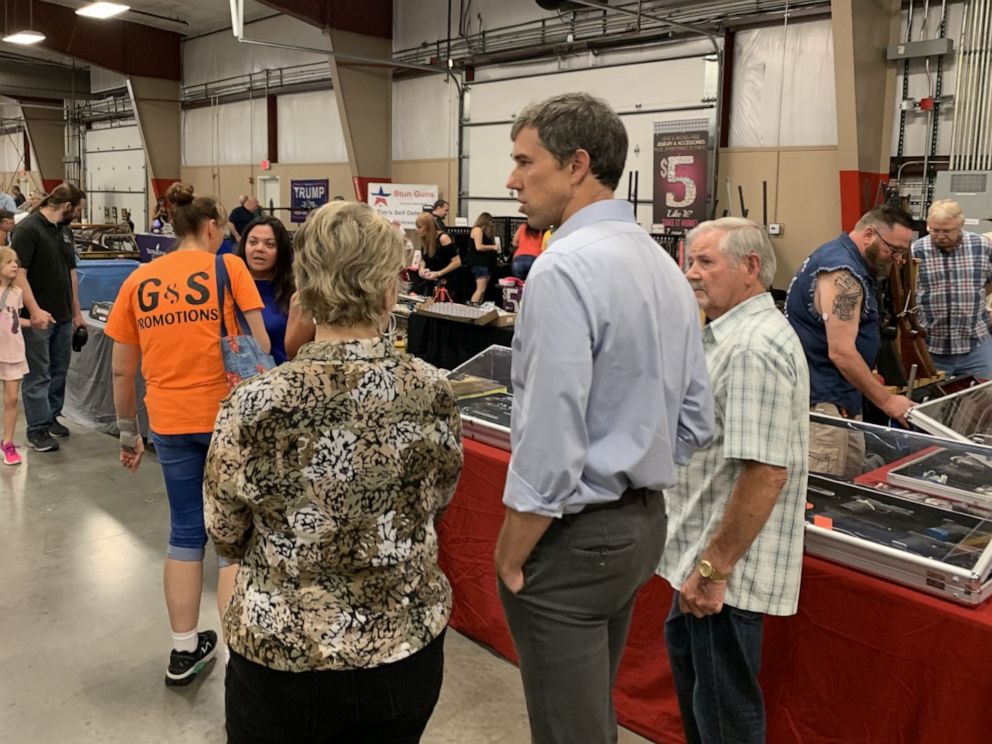 PHOTO: Beto O'Rourke walks around a gun show in Conway, Arkansas on August 17.