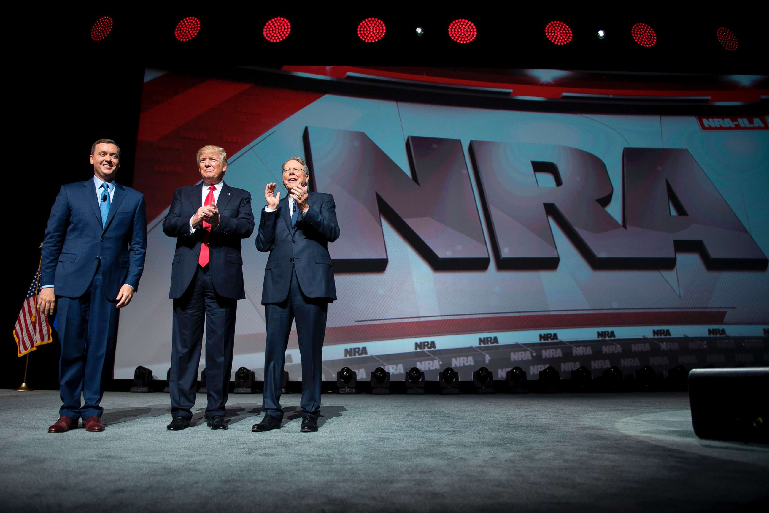 PHOTO: President Donald Trump stands with National Rifle Association (NRA) President Wayne LaPierre, right, and NRA-ILA Executive Director Chris Cox during the NRA Leadership Forum in Atlanta, April 28, 2017. 