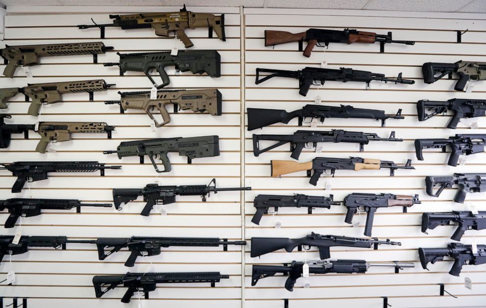 PHOTO: In this Oct. 2, 2018, file photo, semi-automatic rifles fill a wall at a gun shop in Lynnwood, Wash. Mass shootings in Georgia and Colorado in March 2021, have reignited calls from gun control advocates for restrictions on firearms and ammunition.