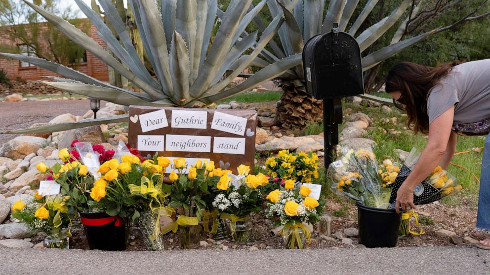 PHOTO: A well-wisher leaves flowers outside of Nancy Guthrie's home in the Catalina Foothills in Tucson, Arizona, February 11, 2026.