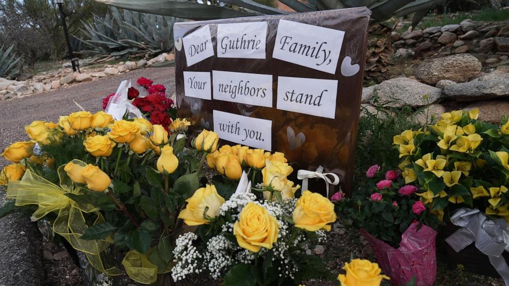 PHOTO: A small vigil grows near Nancy Guthrie's house, Feb. 11, 2026 in Tucson, Ariz.