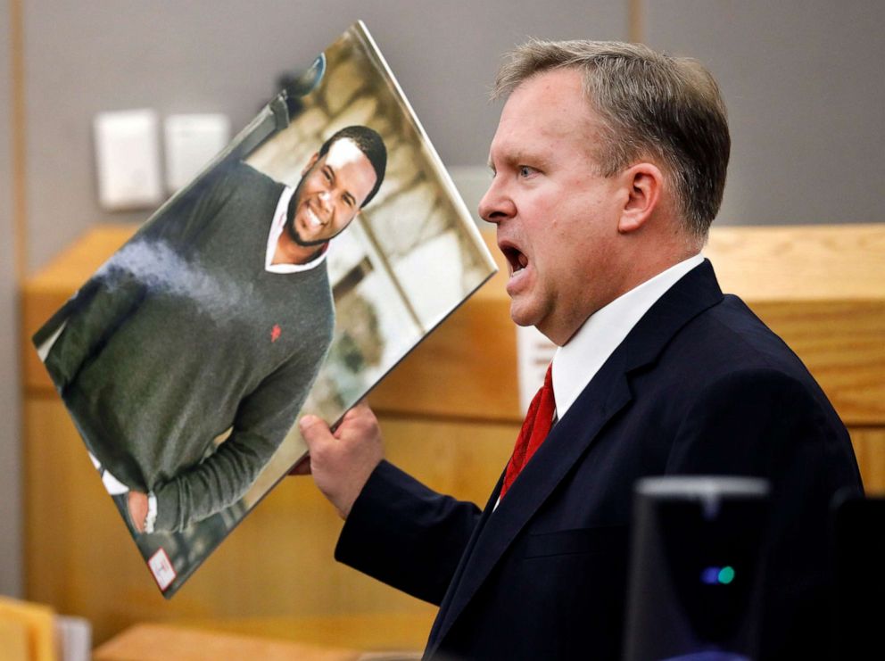 PHOTO: Assistant District Attorney Jason Hermus waves a photo of Botham Jean at the jury as he presents his closing arguments in Amber Guygers murder trial in Dallas, Texas, Sept. 30, 2019. 