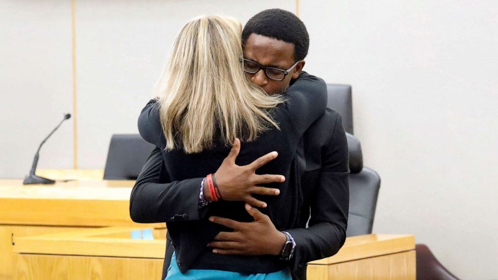 PHOTO: Botham Jean's younger brother Brandt Jean hugs former Dallas police officer Amber Guyger following her 10-year prison sentence for murder at the Frank Crowley Courts Building in Dallas, Texas, Oct. 2, 2019.