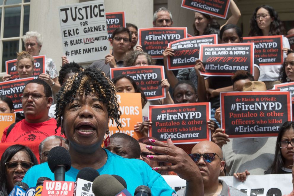 PHOTO: Gwen Carr, whose son Eric Garner was killed by an NYPD officer, is surrounded by supporters as she speak during a news conference outside City Hall, July 17, 2018, in New York.