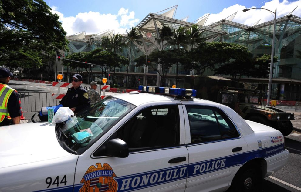 PHOTO: Honolulu police guard road closures around the Convention Center in Honolulu, Hawaii, on November 10 , 2011 during the Asia-Pacific Economic Cooperation (APEC) Summit.