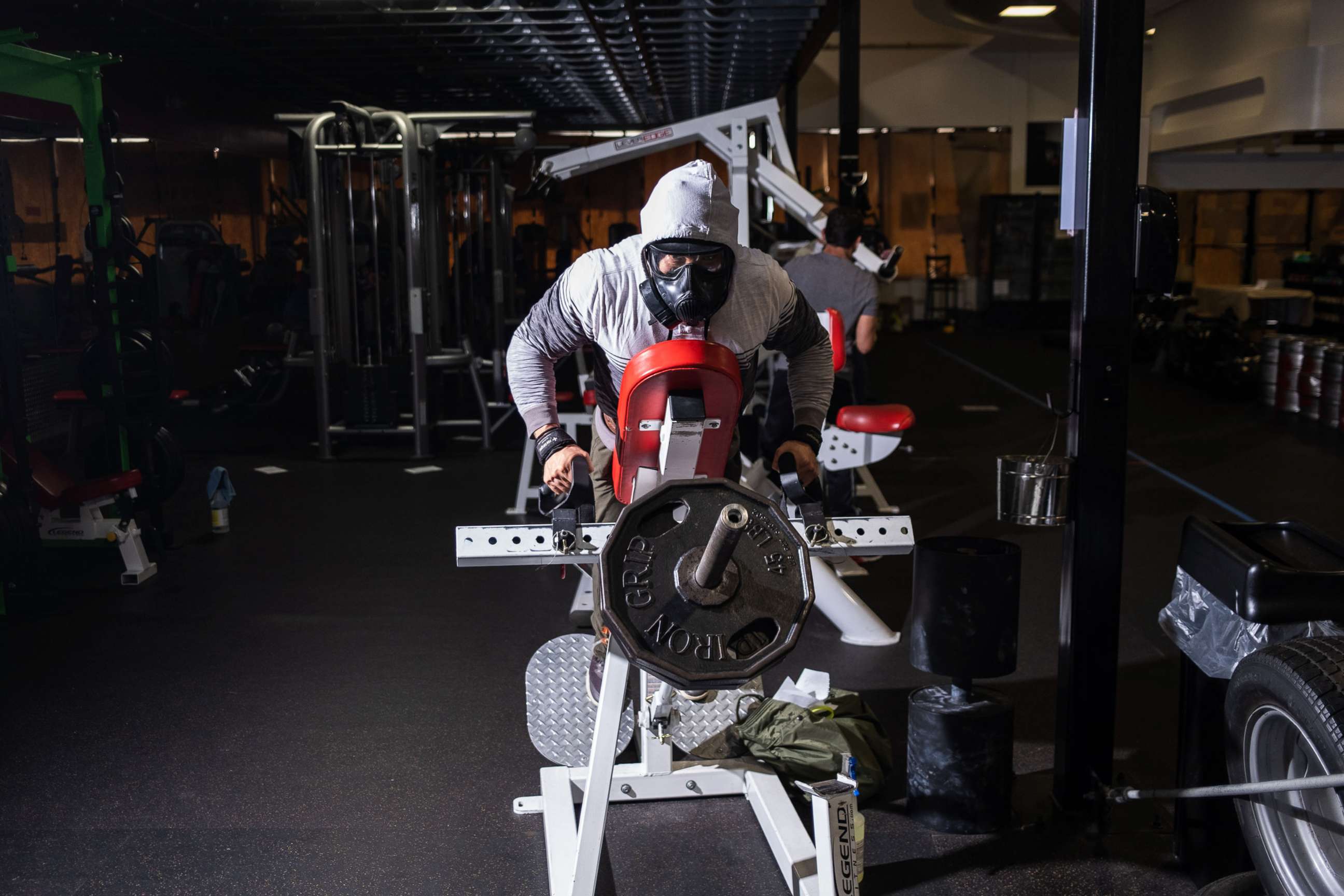 PHOTO: A man wears a mask while working out out at a gym in Bellmawr, N.J., May 22, 2020.