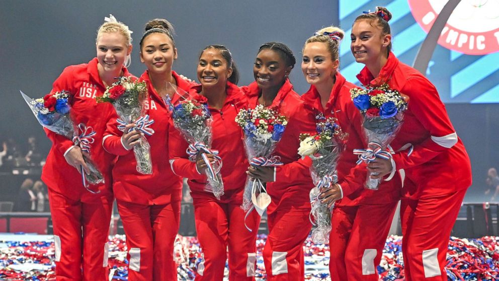 PHOTO: U.S. gymnastics Olympic team members Jade Carey, Sunisa Lee, Jordan Chiles, Simone Biles, Mikayla Skinner and Grace McCallum pose for a photo at the America's Center in St. Louis.