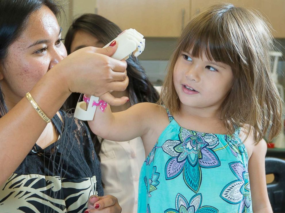PHOTO: Hailey Dawson, a 7-year-old from Nevada, has thrown the first pitch with her 3-D printed hand for two major league baseball teams and hopes to reach her goal of 28 more.