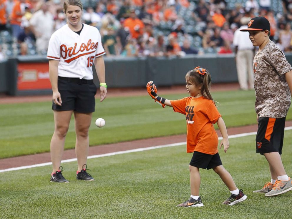 PHOTO: Hailey Dawson, a 7-year-old from Nevada, has thrown the first pitch with her 3-D printed hand for two major league baseball teams and hopes to reach her goal of 28 more.