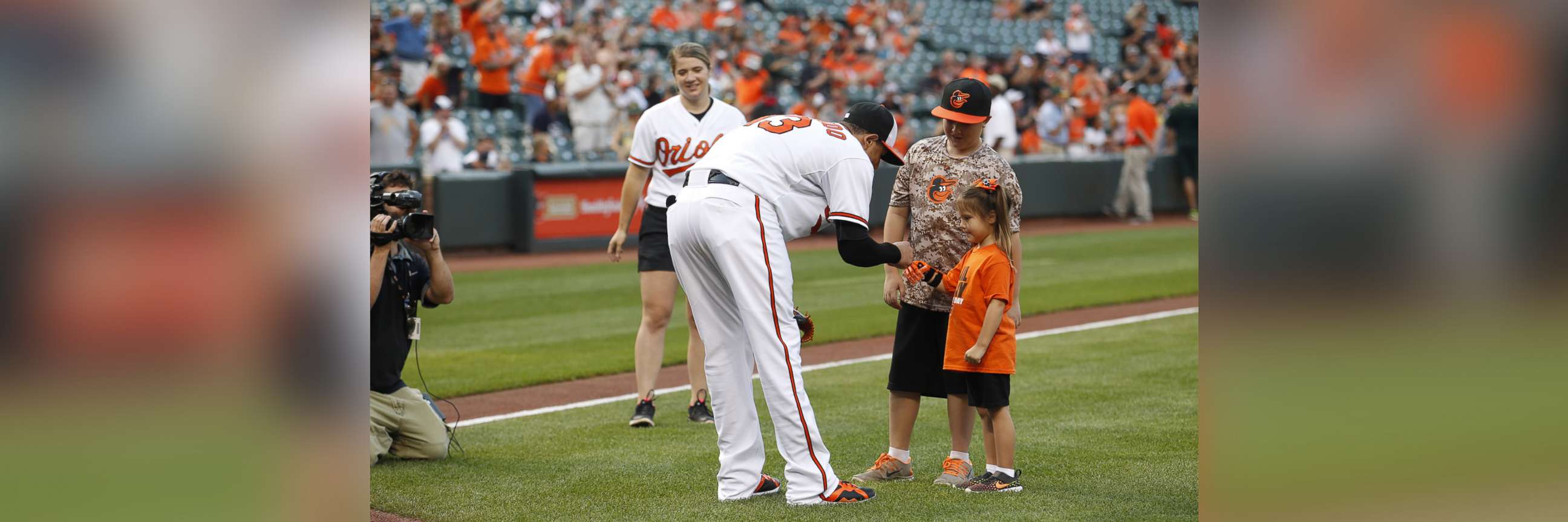 PHOTO: Hailey Dawson, a 7-year-old from Nevada, has thrown the first pitch with her 3-D printed hand for two major league baseball teams and hopes to reach her goal of 28 more. 