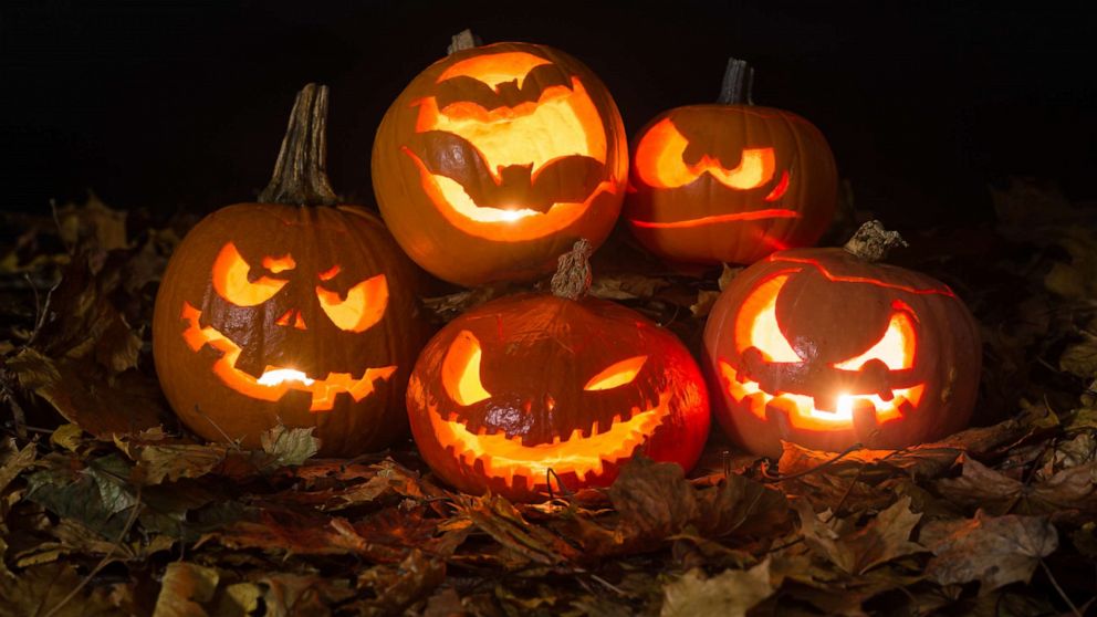 PHOTO: Halloween pumpkins lit by candles.