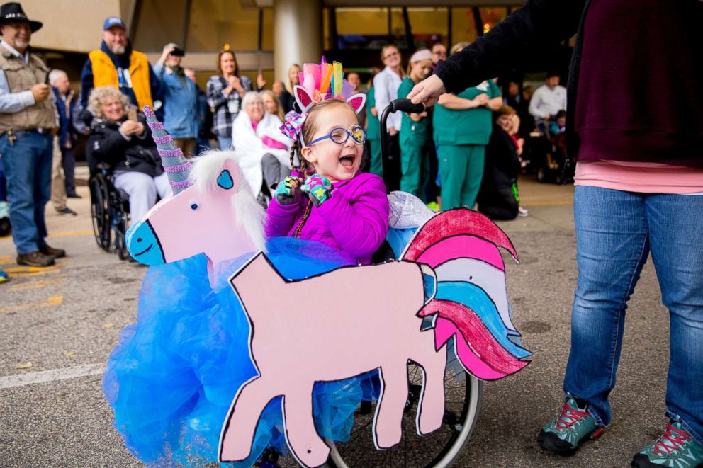PHOTO: Children take part in the third annual Halloween Heroes wheelchair parade at Mary Free Bed Rehabilitation Hospital in Grand Rapids, Michigan.