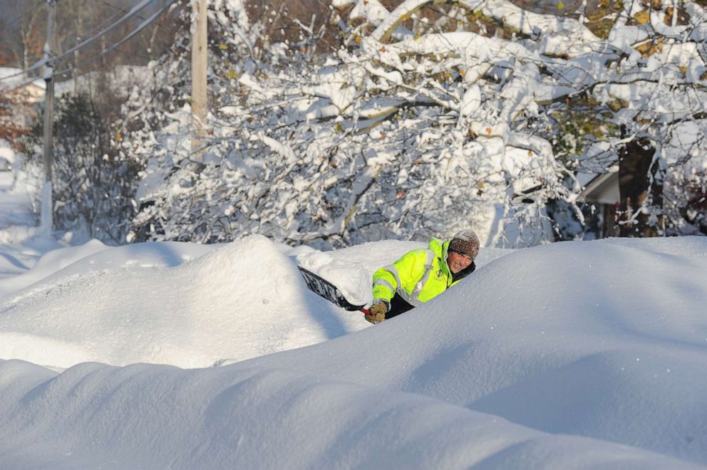 PHOTO: Brett Witkowski digs out after an intense lake-effect snowstorm impacted the area on Nov. 19, 2022, in Hamburg, N.Y.